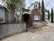 Charming brick home features a well-maintained facade with a concrete block foundation and awning over the front porch at 227/229/3 Fishburne/Woodall St, Charleston, SC 29403