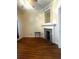Bright room features wood floors, decorative fireplace with a mirror, and neutral walls, perfect for relaxing at 227 Fishburne St, Charleston, SC 29403
