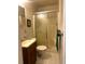 Bathroom with a single sink, toilet, and shower with a sliding glass door at 227/229/3 Fishburne/Woodall St, Charleston, SC 29403