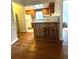 Eat-in kitchen with wood cabinets, breakfast bar, and hardwood floors at 227/229/3 Fishburne/Woodall St, Charleston, SC 29403