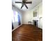 Living room with hardwood floors, fireplace, and abundant natural light at 227/229/3 Fishburne/Woodall St, Charleston, SC 29403