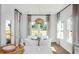 Bright dining area with natural light, hardwood floors, stylish pendant lighting, and contemporary decor at 257 Camellia Bloom Dr, Moncks Corner, SC 29461