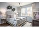 Serene bedroom with a comfortable bed, stylish decor, and large windows with natural lighting at 261 Camellia Bloom Dr, Moncks Corner, SC 29461