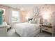 Charming bedroom with pink accents, decorative chandelier, and cozy furnishings at 261 Camellia Bloom Dr, Moncks Corner, SC 29461