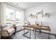 Bright home office featuring a modern desk, stylish decor, and large windows at 261 Camellia Bloom Dr, Moncks Corner, SC 29461
