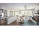 Open concept living room with stainless steel appliances and a view to the dining area at 261 Camellia Bloom Dr, Moncks Corner, SC 29461