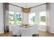 Cozy dining area featuring lots of windows and a view of the backyard at 265 Camellia Bloom Dr, Moncks Corner, SC 29461