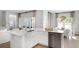 Open-concept kitchen showcasing a center island, stainless steel dishwasher, and bright natural light at 265 Camellia Bloom Dr, Moncks Corner, SC 29461