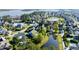 An aerial view of a charming neighborhood with a tranquil pond and lush greenery at 2805 Stay Sail Way, Mount Pleasant, SC 29466