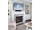Elegant fireplace with built-in shelves and a mounted TV at 2805 Stay Sail Way, Mount Pleasant, SC 29466