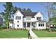 Beautiful two-story home featuring a manicured lawn and a welcoming entryway at 2805 Stay Sail Way, Mount Pleasant, SC 29466