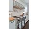 Gourmet kitchen with stainless steel range, hood, and pot filler faucet at 2805 Stay Sail Way, Mount Pleasant, SC 29466