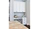 Workspace in kitchen with cabinets, drawers, counter space, and dark wood floors at 2805 Stay Sail Way, Mount Pleasant, SC 29466