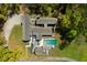 Bird's-eye view of a unique modern home, accented by a refreshing pool and serene landscaping at 2885 Plow Ground Rd, Johns Island, SC 29455