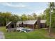 Aerial view of home with pool, and patio, and a wooded landscape at 2885 Plow Ground Rd, Johns Island, SC 29455