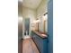 Bathroom boasting a wood countertop with dual sinks, modern fixtures, and a decorative shower with tiled walls at 2885 Plow Ground Rd, Johns Island, SC 29455