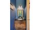 A powder room features blue walls and a rich wood vanity at 2885 Plow Ground Rd, Johns Island, SC 29455