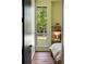Bedroom showcasing a built-in desk, a tall window, and hardwood floors, creating a warm and inviting atmosphere at 2885 Plow Ground Rd, Johns Island, SC 29455