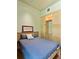 This bedroom features a comfortable bed and a built-in wardrobe and shelving unit at 2885 Plow Ground Rd, Johns Island, SC 29455
