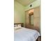 Bedroom with a built-in cabinet and hardwood floors, offering stylish and functional living space at 2885 Plow Ground Rd, Johns Island, SC 29455