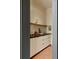 A butler's pantry features custom cabinets and a dark countertop with a wooden shelf at 2885 Plow Ground Rd, Johns Island, SC 29455