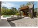 Stunning exterior view featuring a swimming pool and shed-roof structure with inviting seating and lush landscaping at 2885 Plow Ground Rd, Johns Island, SC 29455