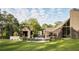 Modern home with pool and metal roof surrounded by lush green landscaping at 2885 Plow Ground Rd, Johns Island, SC 29455
