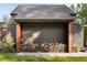 Modern home with metal roof featuring convenient outdoor firewood storage at 2885 Plow Ground Rd, Johns Island, SC 29455