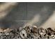 Stack of firewood against a wooden wall, casting shadows at 2885 Plow Ground Rd, Johns Island, SC 29455