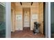 Inviting foyer featuring herringbone wood floors, light walls, and a unique bird statue at 2885 Plow Ground Rd, Johns Island, SC 29455
