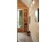 Hallway showing custom wood detail, shelving, and reading nook with nature views and abundant natural light at 2885 Plow Ground Rd, Johns Island, SC 29455
