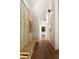 Hallway features custom bench and coat rack, hardwood floors and neutral paint at 2885 Plow Ground Rd, Johns Island, SC 29455