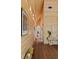 Hallway featuring wood walls, wood floors, light fixtures, and artwork at 2885 Plow Ground Rd, Johns Island, SC 29455