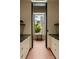 This bright hallway has custom cabinets and a view to the outdoors at 2885 Plow Ground Rd, Johns Island, SC 29455