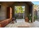 Outdoor living area featuring wood details, seating, and easy access to outdoor greenery at 2885 Plow Ground Rd, Johns Island, SC 29455