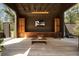 Outdoor living space with wood accents, built-in cabinets, a TV, and a coffee table for relaxing at 2885 Plow Ground Rd, Johns Island, SC 29455