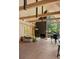 Sun-filled living room with hardwood floors, fireplace, and grand piano at 2885 Plow Ground Rd, Johns Island, SC 29455