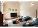 A well-lit living room features hardwood floors, neutral walls, and large windows at 2885 Plow Ground Rd, Johns Island, SC 29455