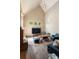 A living room with hardwood floors, a high ceiling and many windows for plenty of natural light at 2885 Plow Ground Rd, Johns Island, SC 29455