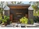 Stylish outdoor entertainment area featuring a custom structure with a flat-screen TV and comfortable lounge area at 2885 Plow Ground Rd, Johns Island, SC 29455