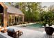 Backyard featuring a stunning in-ground pool, a concrete patio, a spa, and outdoor furniture at 2885 Plow Ground Rd, Johns Island, SC 29455