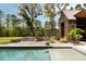 An inviting pool and stylish deck creates an outdoor retreat, blending relaxation with modern architecture and natural tranquility at 2885 Plow Ground Rd, Johns Island, SC 29455