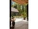 Beautiful home exterior with a pool, deck, and lush landscaping, creating a private outdoor oasis at 2885 Plow Ground Rd, Johns Island, SC 29455
