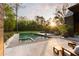 Backyard featuring a stunning in-ground pool, a concrete patio, and lush landscaping at 2885 Plow Ground Rd, Johns Island, SC 29455