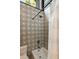 Shower featuring a decorative tiled wall, a shower head, and a tub, creating a stylish and relaxing experience at 2885 Plow Ground Rd, Johns Island, SC 29455