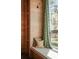 Window seat featuring verdant views of the surrounding forest, custom wood detail, and natural light at 2885 Plow Ground Rd, Johns Island, SC 29455