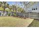 Backyard featuring a grassy lawn with mature trees, a privacy fence, and shade at 2928 Tranquility Rd, Mount Pleasant, SC 29466