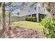 A well-maintained backyard with lush green grass, a privacy fence, and mature trees at 2928 Tranquility Rd, Mount Pleasant, SC 29466