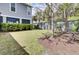 Well-kept backyard with a lush lawn, privacy fencing, and mature trees at 2928 Tranquility Rd, Mount Pleasant, SC 29466