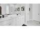 Bathroom with white cabinetry, double sinks, and a sleek frameless shower enclosure for modern convenience at 2928 Tranquility Rd, Mount Pleasant, SC 29466